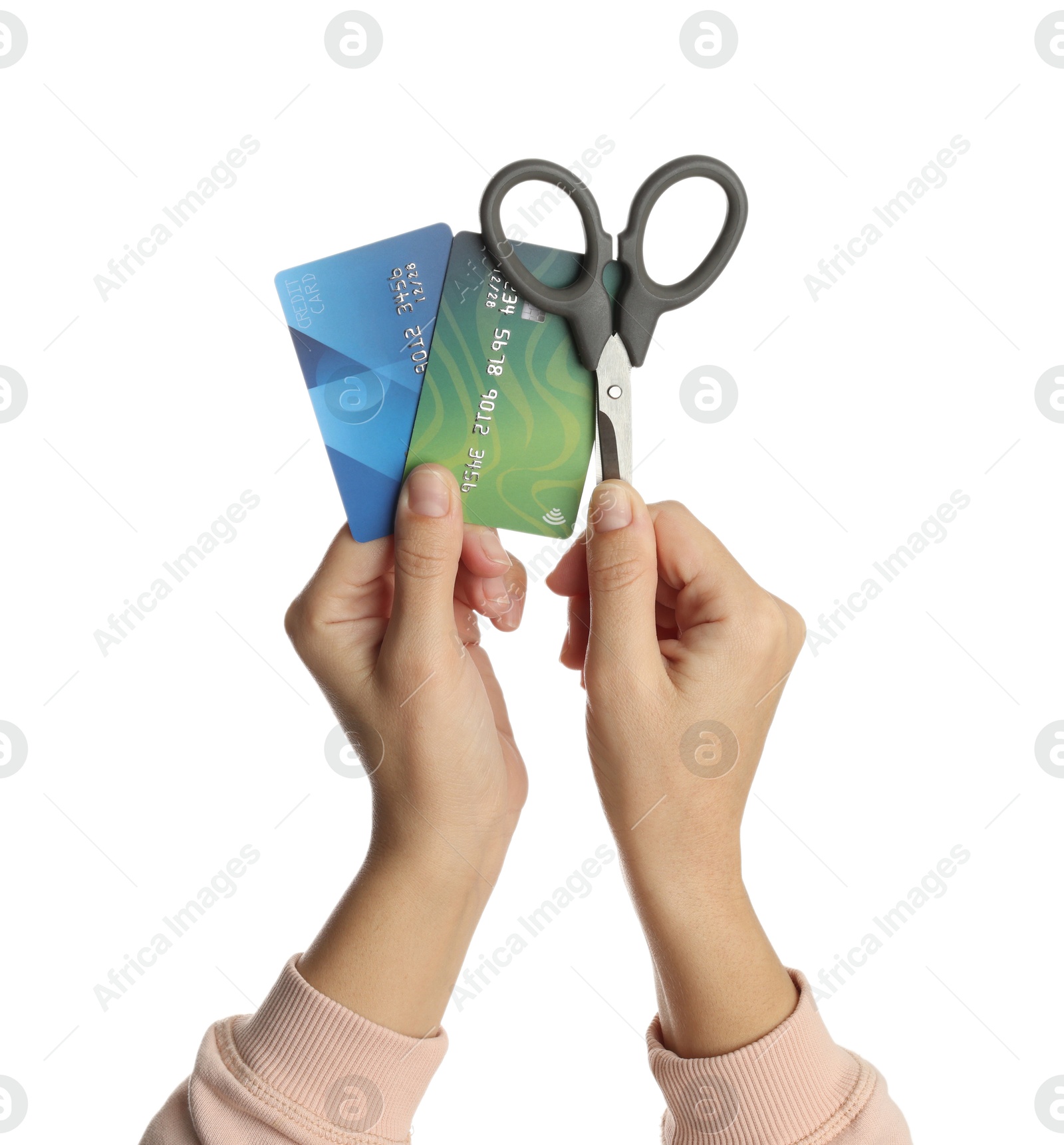 Photo of Woman with credit cards and scissors on white background, closeup