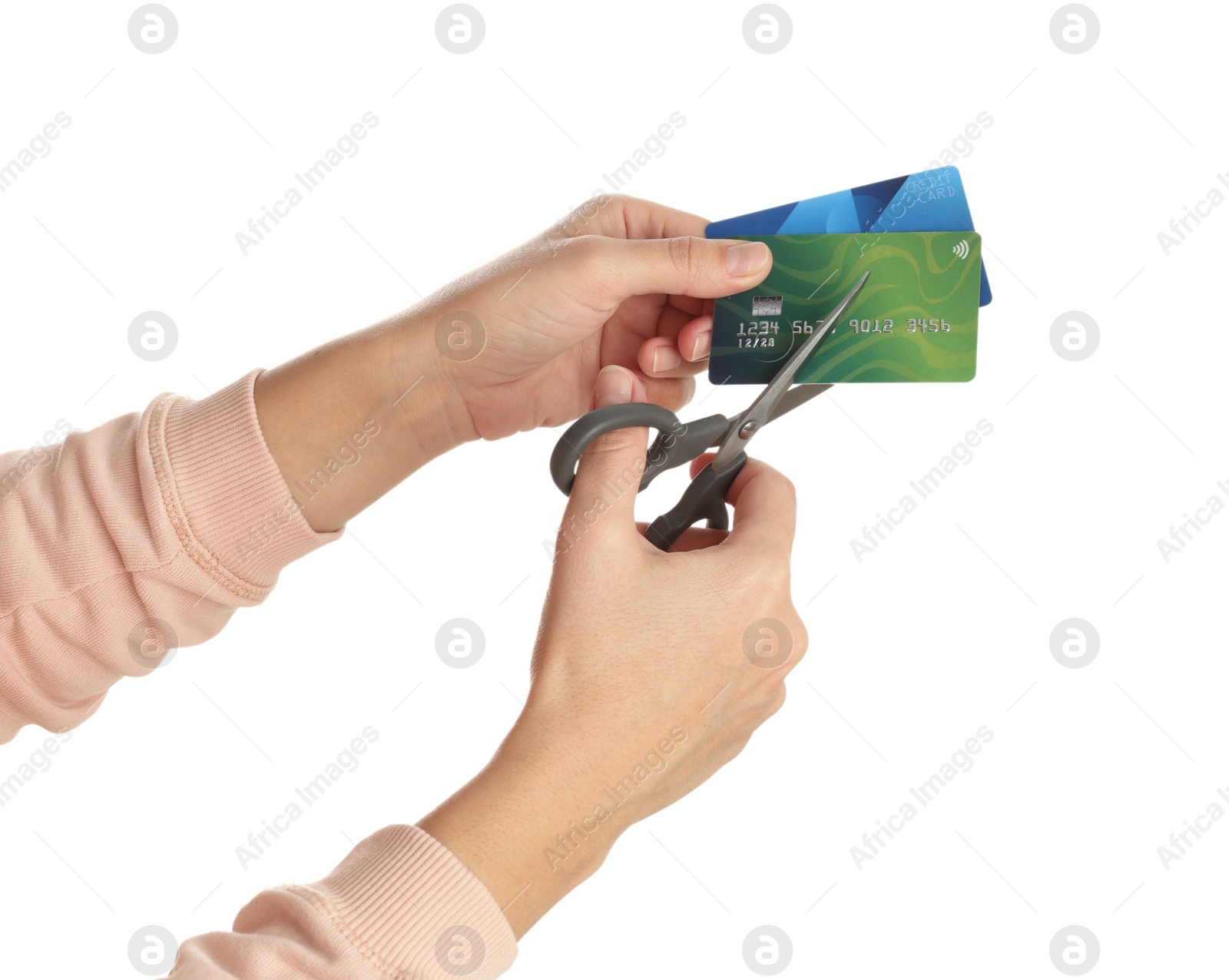 Photo of Woman cutting credit cards on white background, closeup