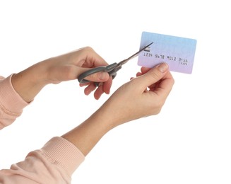 Woman cutting credit card on white background, closeup