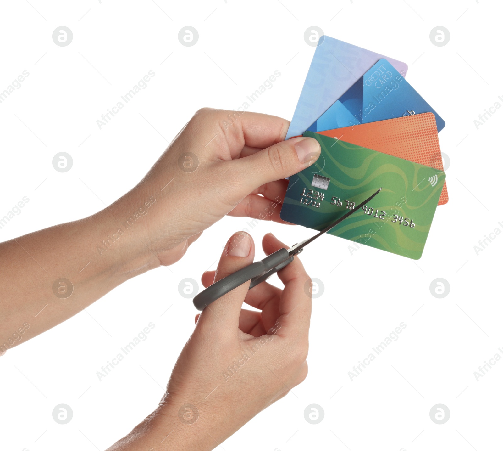 Photo of Woman cutting credit cards on white background, closeup