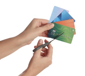 Photo of Woman cutting credit cards on white background, closeup