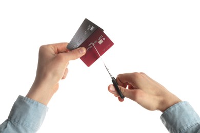 Photo of Woman cutting credit cards on white background, closeup