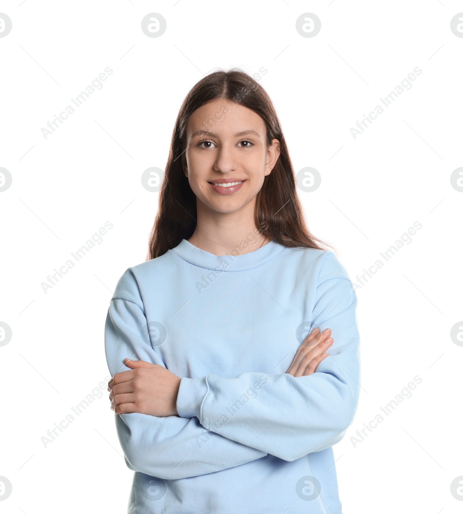 Photo of Portrait of smiling teenage girl with crossed arms on white background