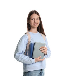 Photo of Portrait of smiling teenage girl with books on white background