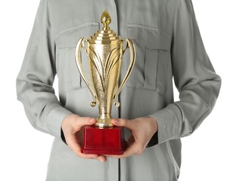 Photo of Woman with golden trophy cup on white background, closeup