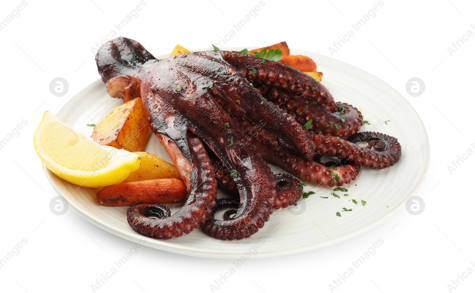 Photo of Roasted octopus with vegetables and lemon isolated on white