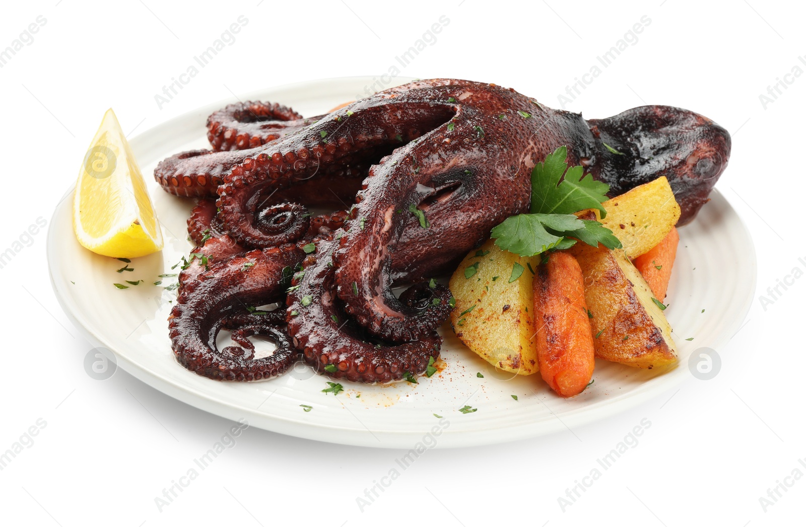 Photo of Roasted octopus with vegetables and lemon isolated on white