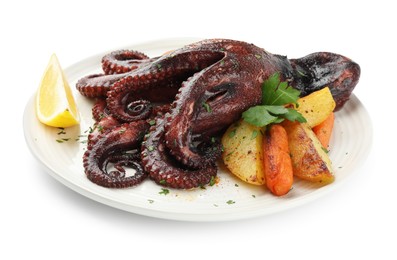 Photo of Roasted octopus with vegetables and lemon isolated on white