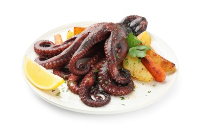 Photo of Roasted octopus with vegetables and lemon isolated on white