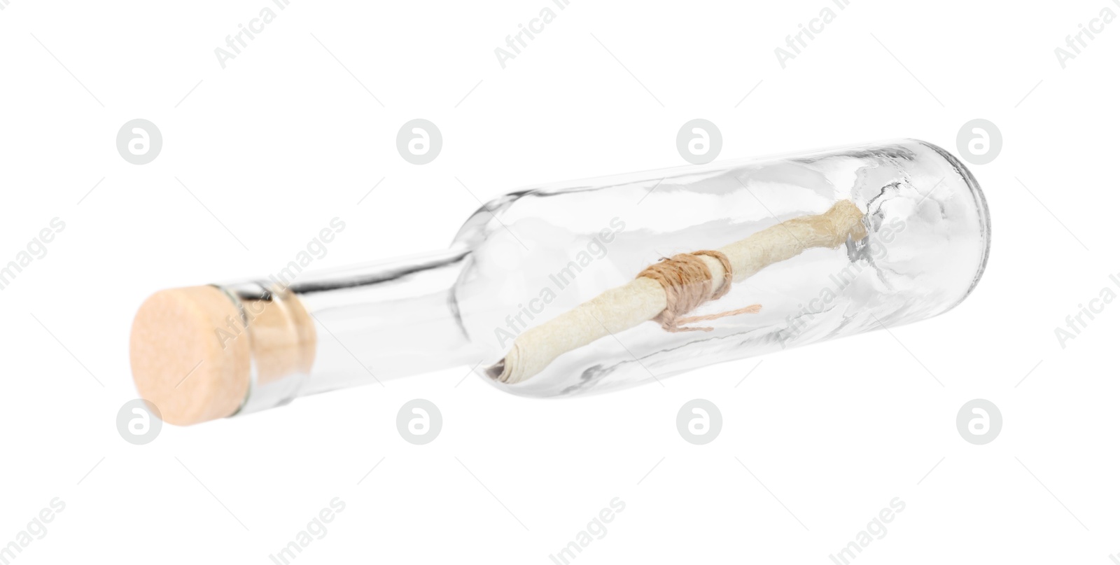 Photo of Corked glass bottle with rolled letter isolated on white