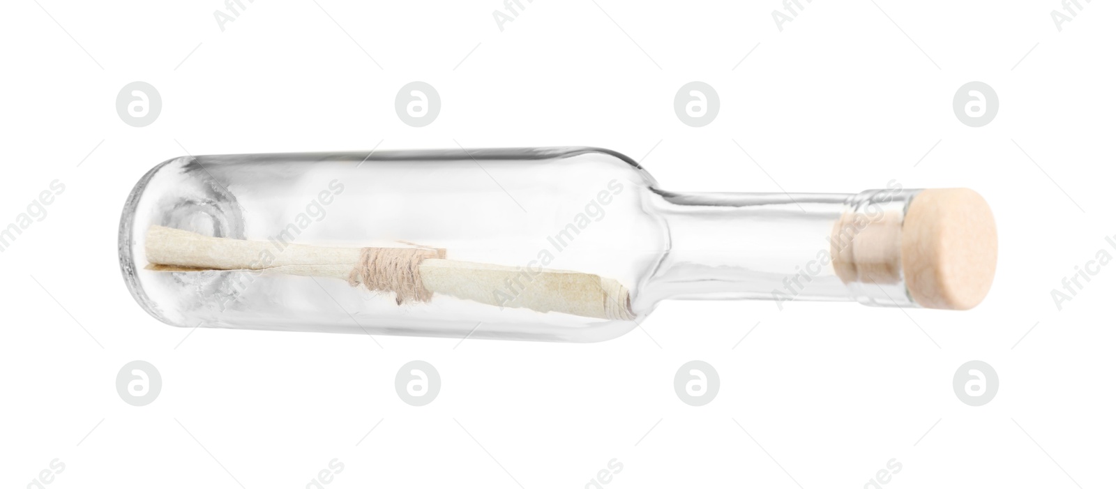 Photo of Corked glass bottle with rolled letter isolated on white