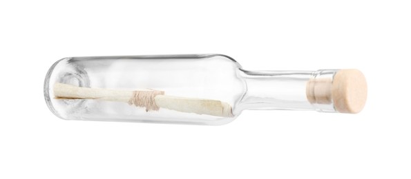 Photo of Corked glass bottle with rolled letter isolated on white