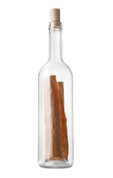 Photo of Corked glass bottle with rolled letter isolated on white