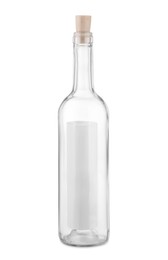 Photo of Corked glass bottle with rolled letter isolated on white