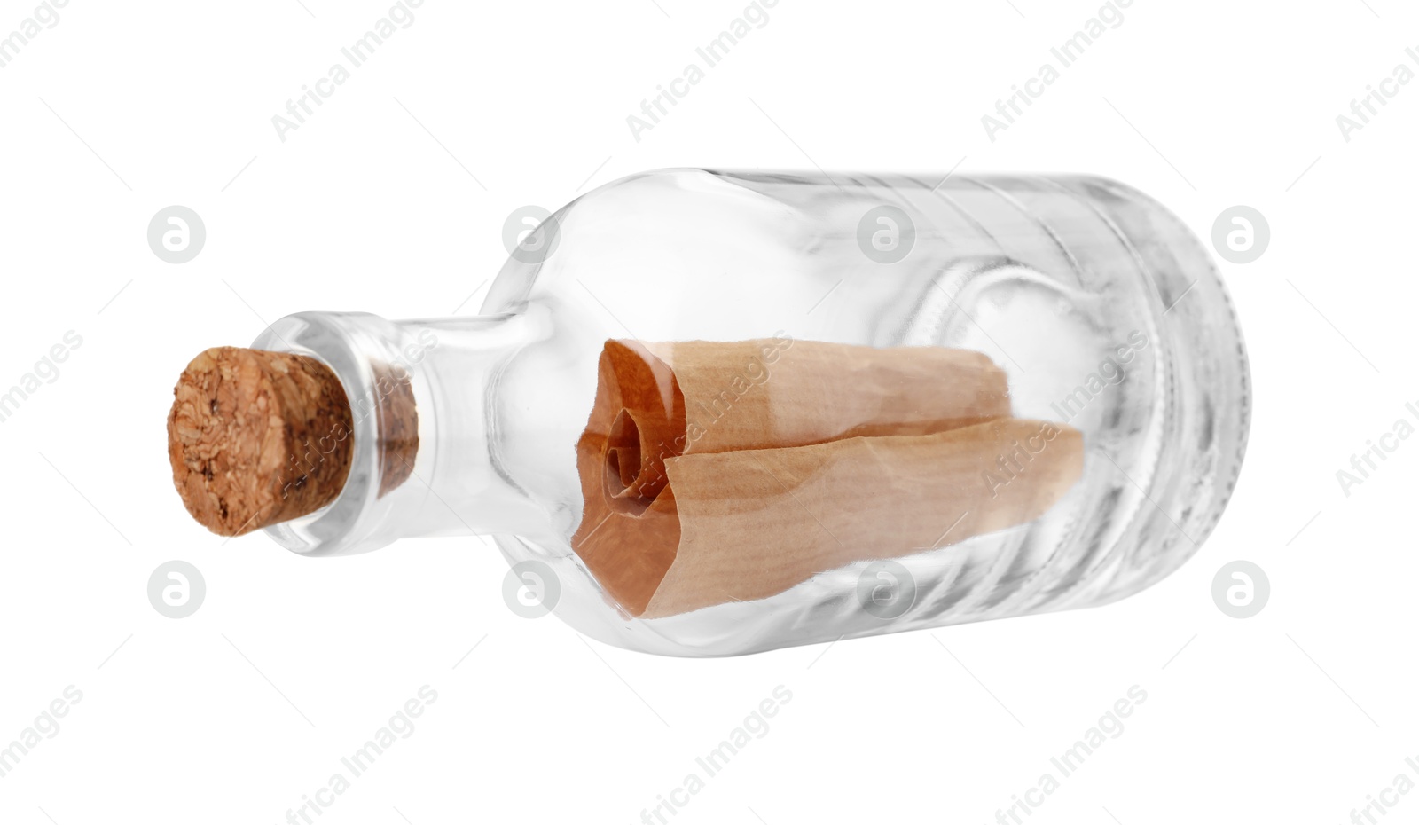 Photo of Corked glass bottle with rolled letter isolated on white