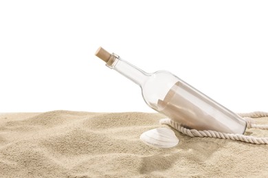 Photo of Rolled letter in corked glass bottle, rope and shell on sand against white background