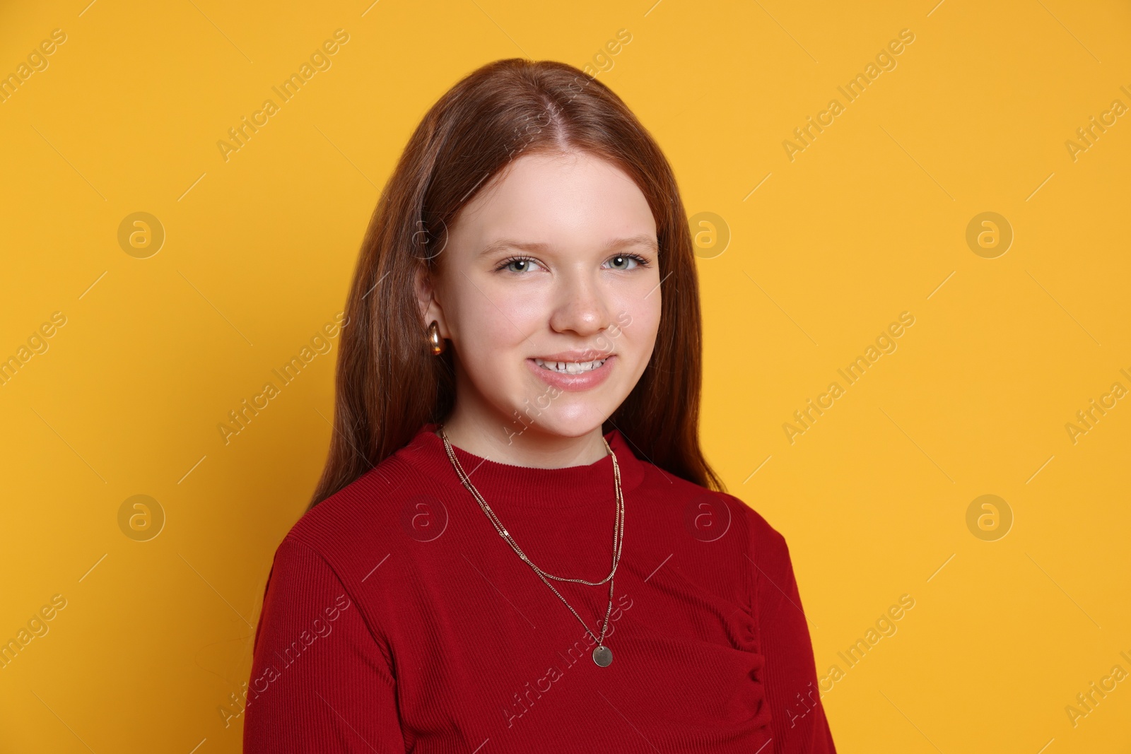 Photo of Teenage girl wearing stylish jewellery on yellow background