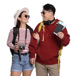 Photo of Happy travellers with passports and camera on white background