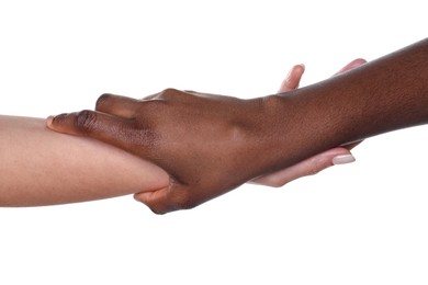 Photo of Stop racism. People of different skin colors holding hands on white background, closeup