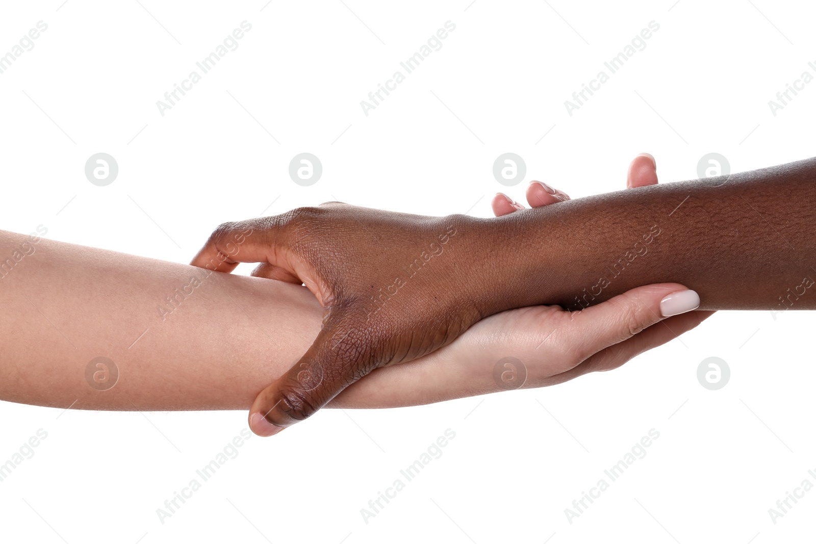 Photo of Stop racism. People of different skin colors holding hands on white background, closeup