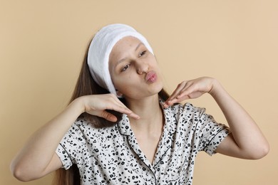 Photo of Teenage girl with acne problem on beige background