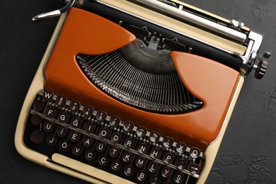 Photo of Vintage typewriter on black background, top view