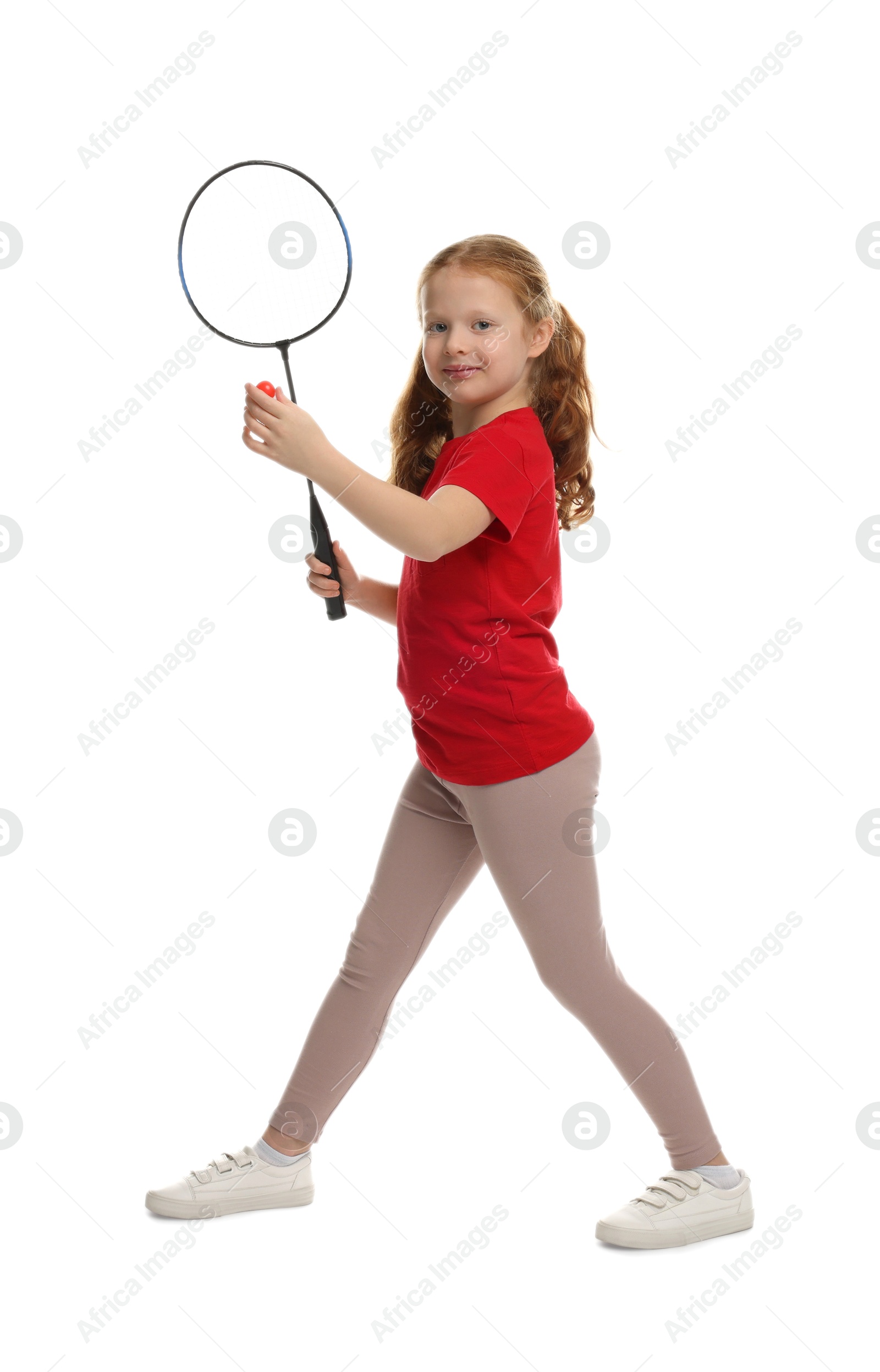 Photo of Little girl with badminton racket and shuttlecock on white background