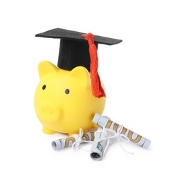 Photo of Piggy bank, graduate hat and dollar banknotes isolated on white. Tuition payment