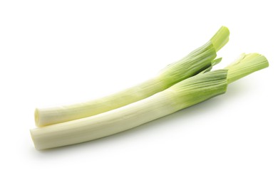 Photo of Fresh leeks isolated on white. Spicy vegetable