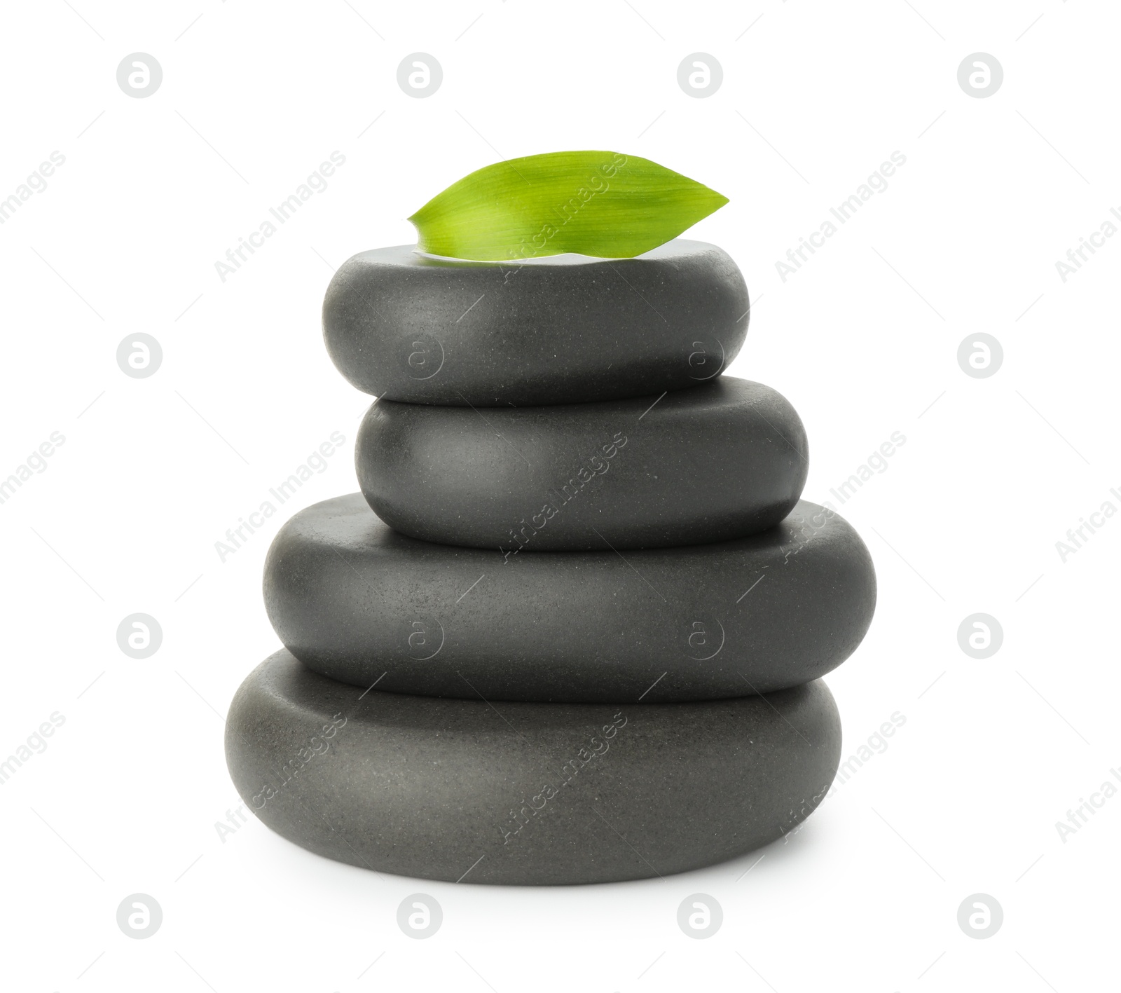 Photo of Spa stones with leaf isolated on white