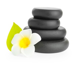 Photo of Spa stones with flower and leaf isolated on white