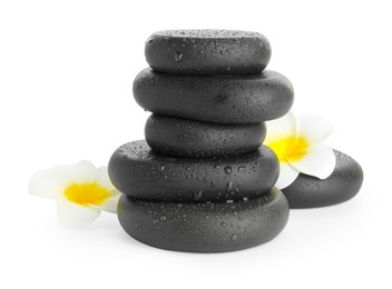 Photo of Wet spa stones with flowers isolated on white