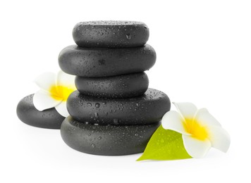 Photo of Wet spa stones with flowers and leaf isolated on white