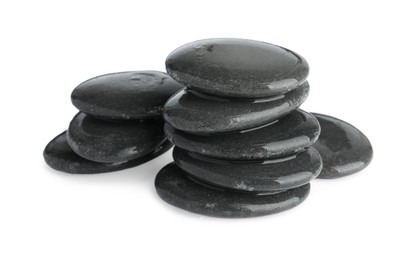 Photo of Wet spa stones isolated on white. Zen and harmony