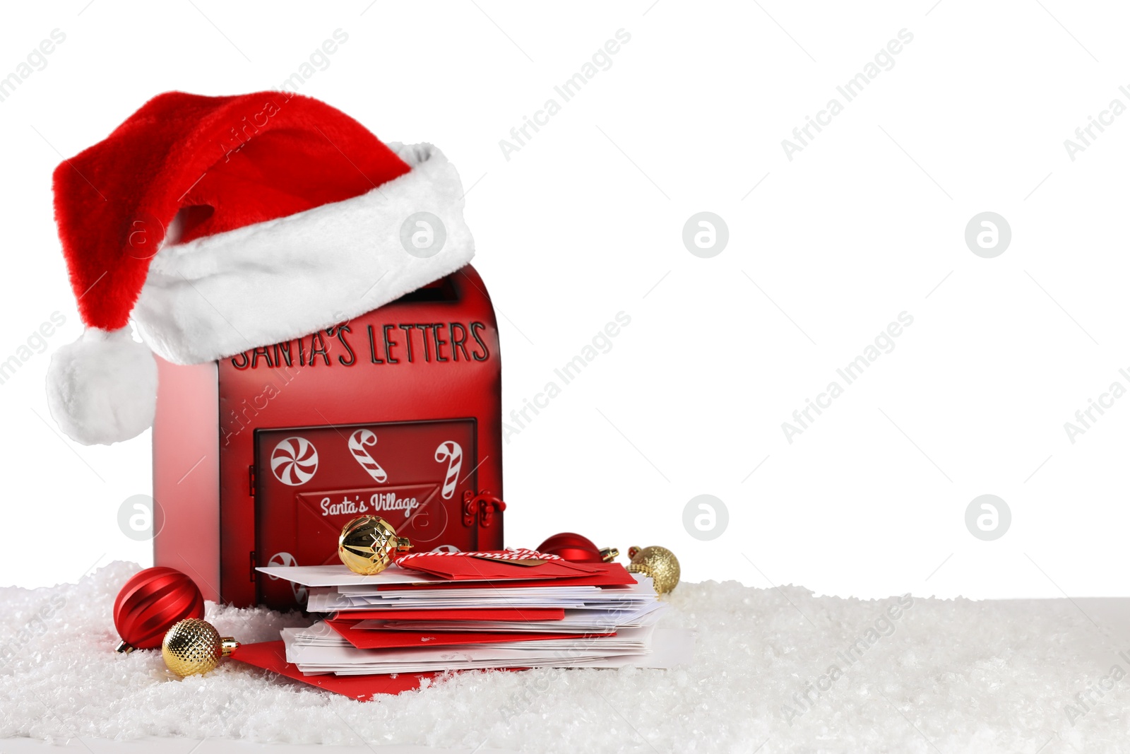 Photo of Santa Claus mail box with hat, letters and Christmas baubles on artificial snow against white background, space for text