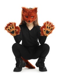 Photo of Quadrobics. Girl wearing fox mask, tail and gloves on white background