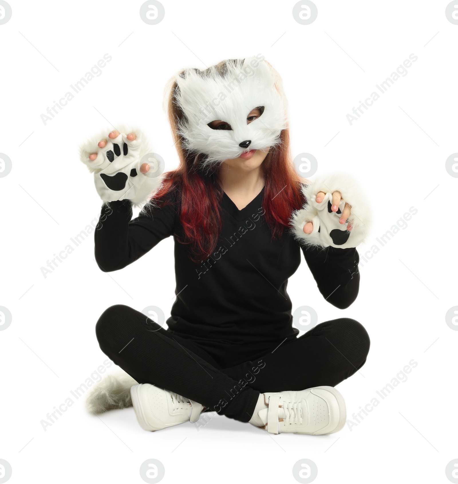 Photo of Quadrobics. Girl wearing cat mask, tail and gloves on white background