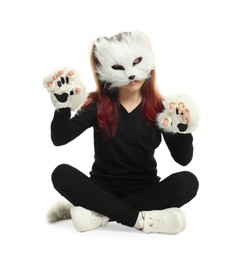 Photo of Quadrobics. Girl wearing cat mask, tail and gloves on white background