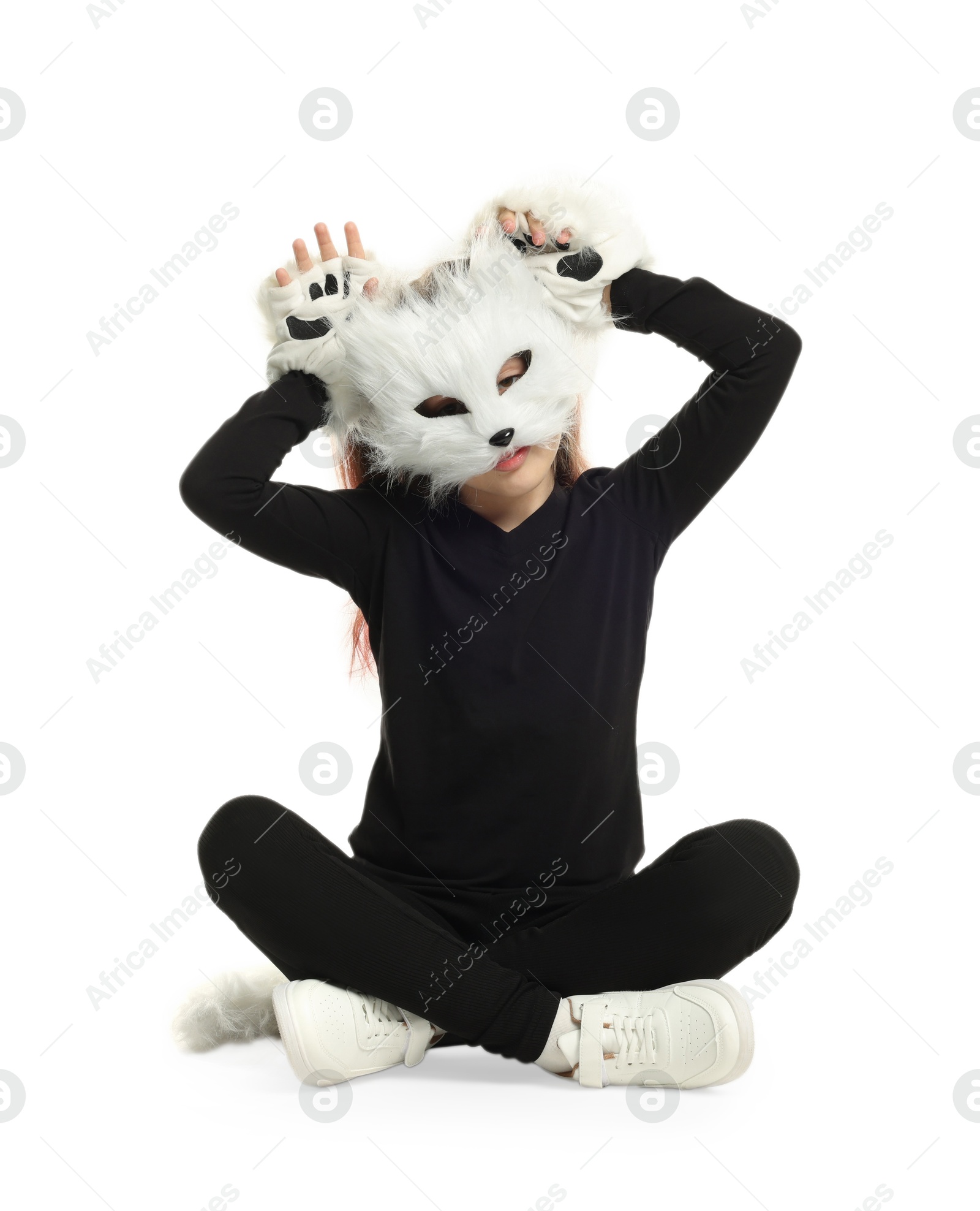 Photo of Quadrobics. Girl wearing cat mask, tail and gloves on white background