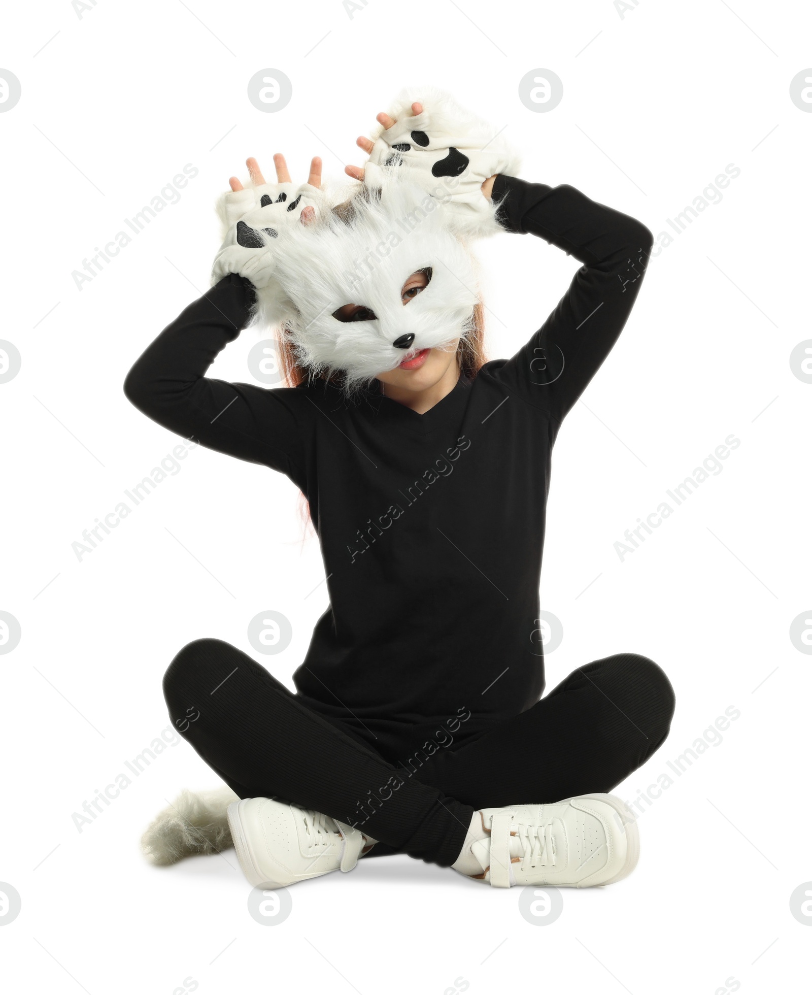 Photo of Quadrobics. Girl wearing cat mask, tail and gloves on white background