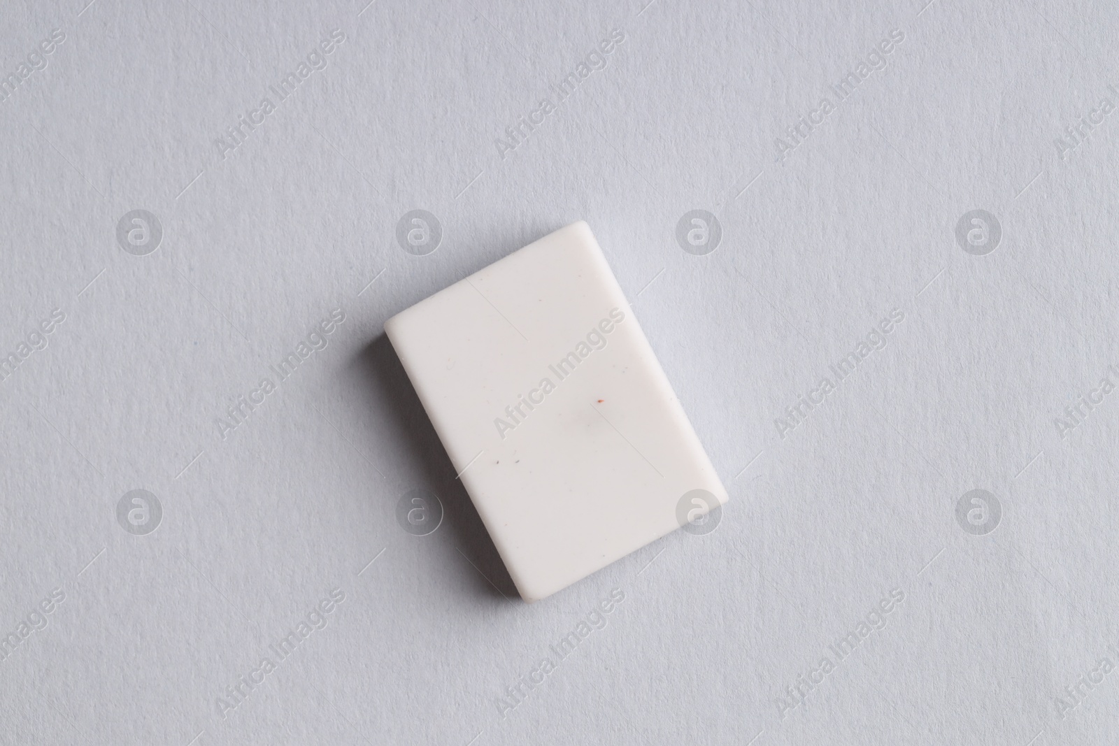 Photo of One eraser on grey background, top view