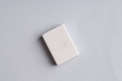 Photo of One eraser on grey background, top view