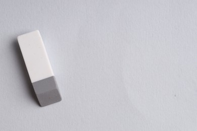 Photo of One eraser on grey background, top view. Space for text