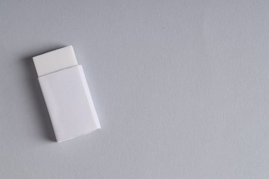 Photo of One eraser on grey background, top view. Space for text