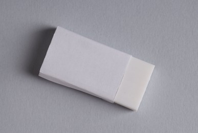 Photo of One eraser on grey background, top view