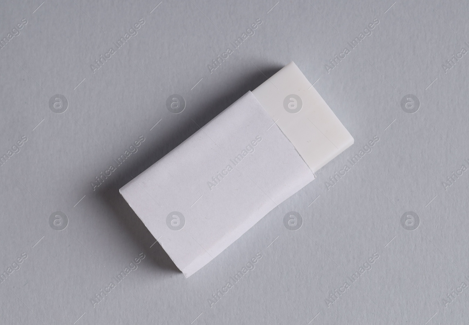 Photo of One eraser on grey background, top view