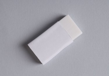 One eraser on grey background, top view