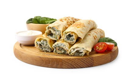 Photo of Tasty rolled crepes with cottage cheese, spinach and tomato isolated on white