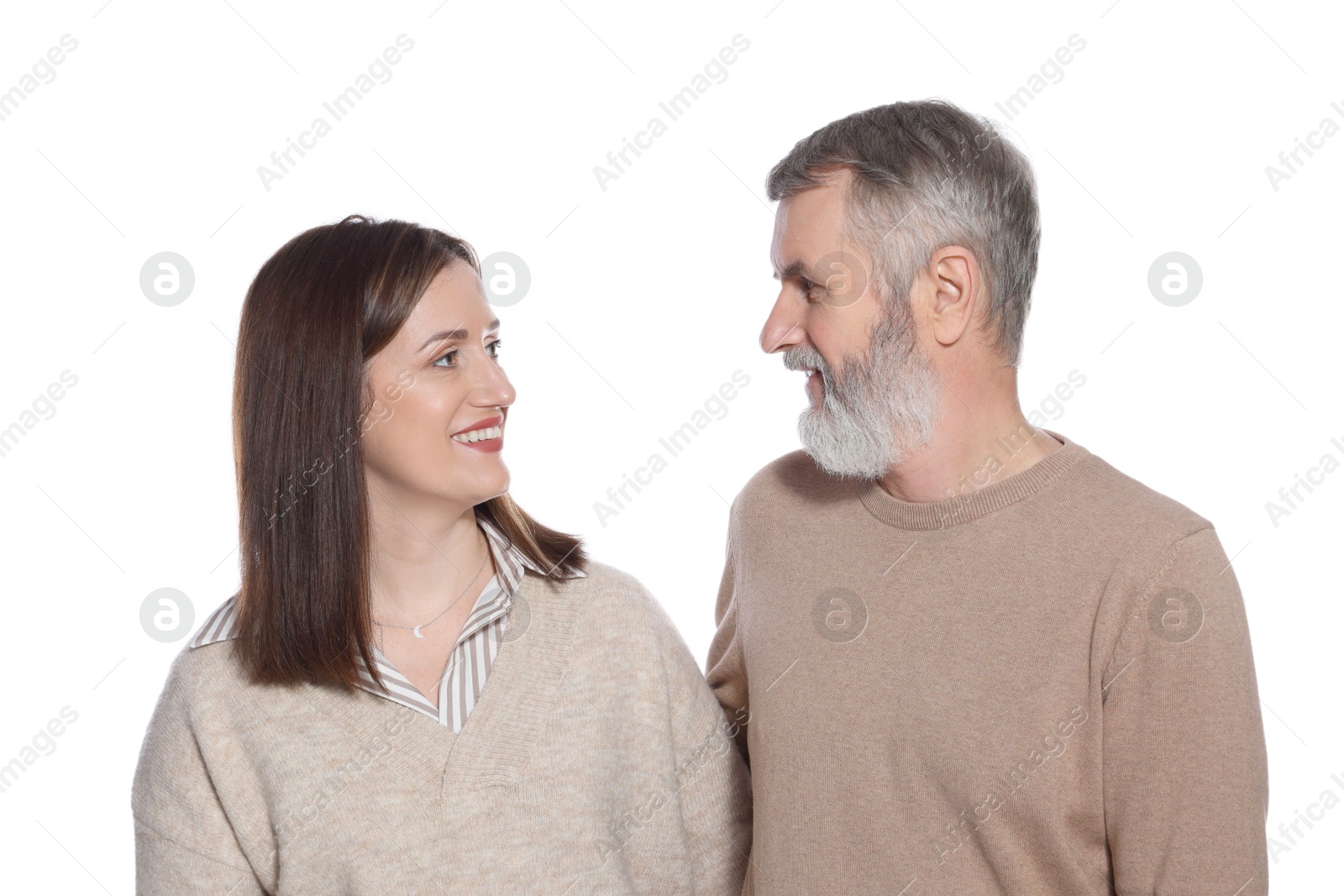 Photo of Happy daughter and her father looking at each other on white background