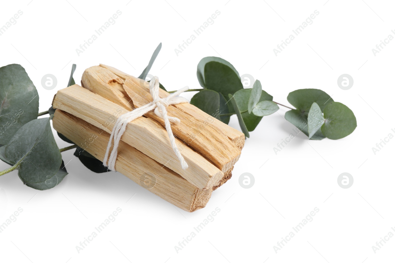 Photo of Palo santo sticks and eucalyptus branches isolated on white